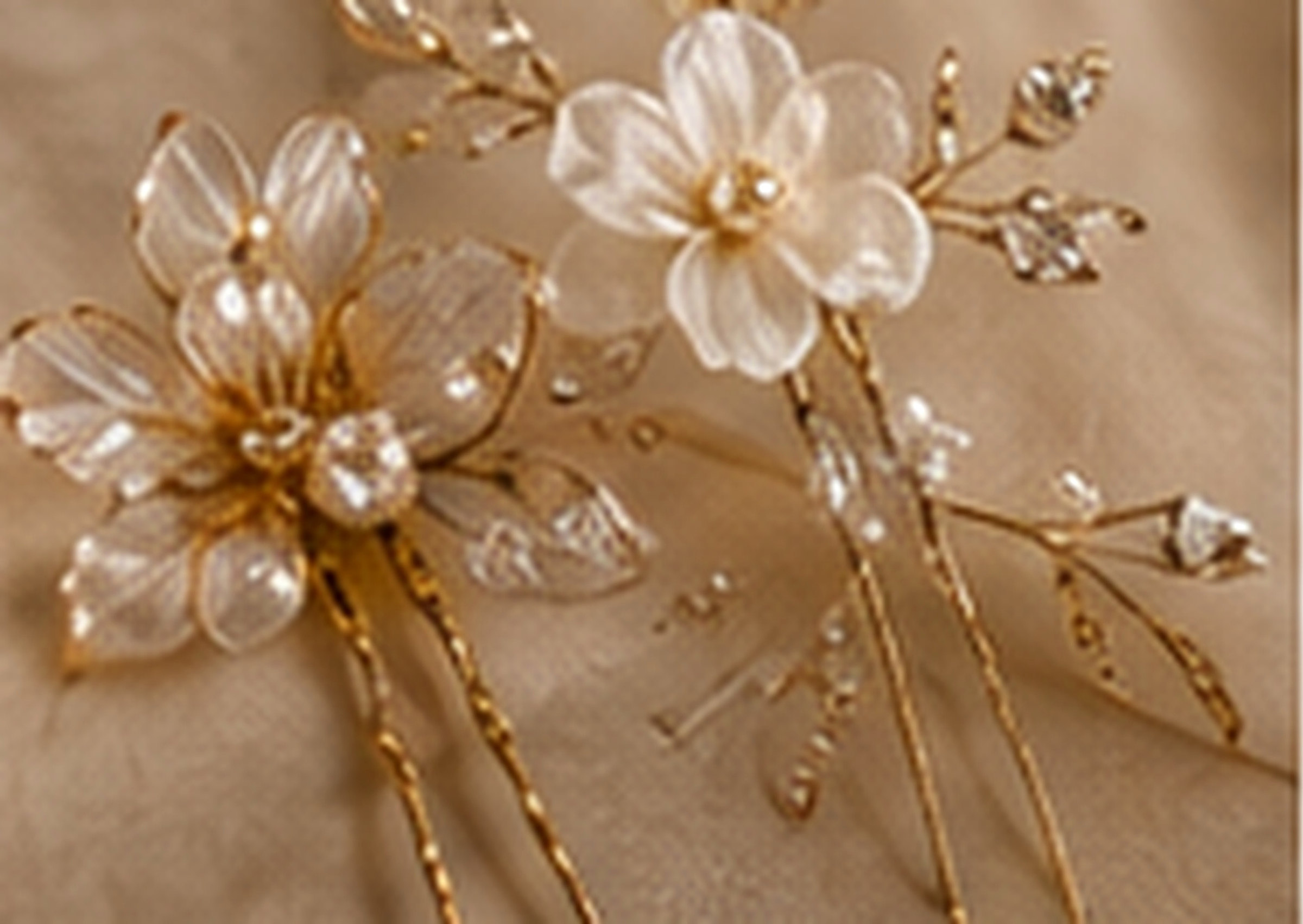 Gold and pearl bridal hair piece with ivory flowers and gold leaves